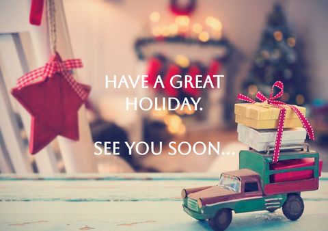 Festive holiday card with cheerful message and gift truck