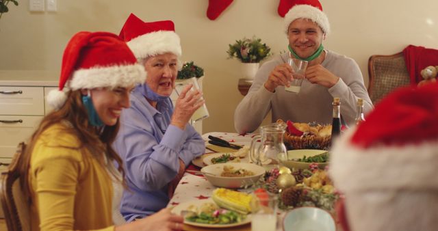 Family members of different ages sharing Christmas dinner, smiling, and enjoying each other's company. Optic for holiday-themed promotions, family-oriented ads, festive articles, and seasonal greeting cards.