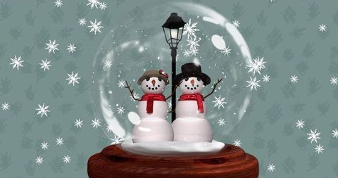 Two snowmen standing inside glass snow globe with lamppost on teal background