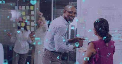 Team Collaborating with Augmented Reality Overlays on Glass Partition During Brainstorming