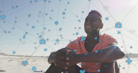 Man Relaxing on Beach Surrounded by Digital Social Media Icons