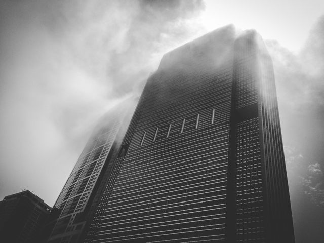 Large Corporate Skyscraper in Morning Fog with Sunlight - Download Free Stock Photos Pikwizard.com