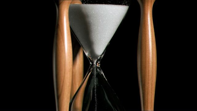 This close-up video of a wooden hourglass with sand flowing perfectly captures the passing of time. The contrast against the black background emphasizes the delicate grains and the craftsmanship of the hourglass. Ideal for themes involving time management, patience, deadlines, and the inevitability of time passing. Perfect for articles, presentations, and educational materials discussing time-related concepts.