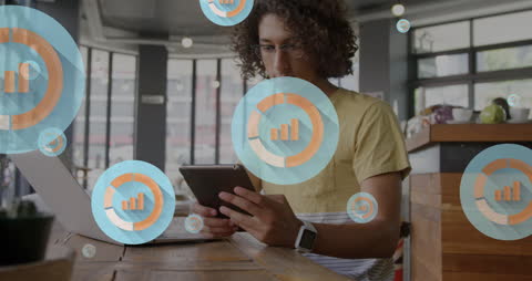 Young Professional Analyzing Data Visualization in Modern Cafe