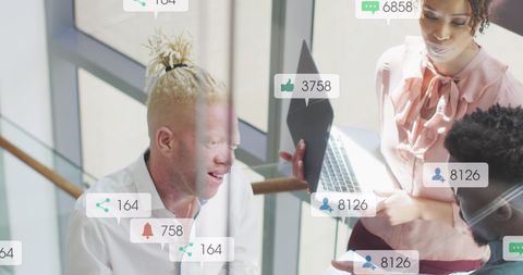 Diverse colleagues engaging in office discussion with social media elements