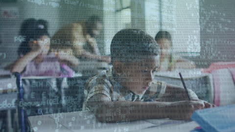 Asian Boy Engaging with Code in Modern Classroom