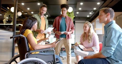 Diverse team engaged in creative brainstorming in modern office