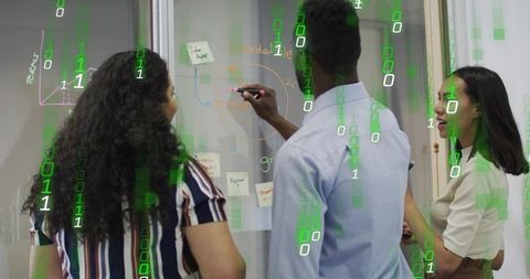 Diverse team brainstorming on glass board with binary digital overlay for tech