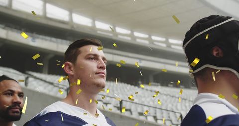 Celebratory Confetti Showering Diverse Sports Team on Pitch