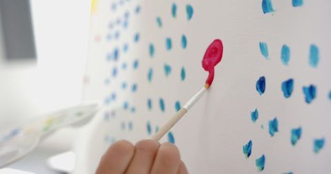 Close-Up of Student Painting on Canvas in Art Class