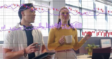 Professionals discussing analytics over coffee with tablet and market charts overlay