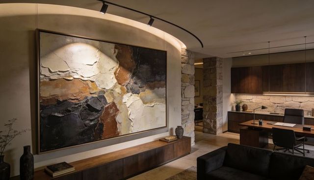 Contemporary living room featuring large textured impasto artwork on curved plaster wall