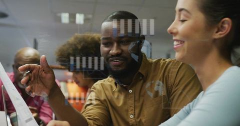 Diverse Team Discussing Data Visualization and Analysis