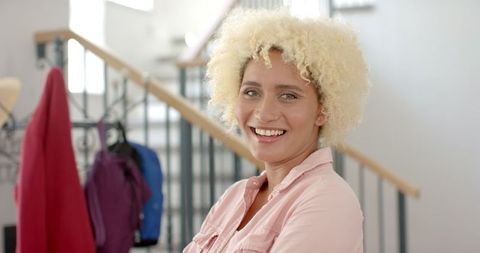smiling young woman at home in casual attire - Download Free Stock Images Pikwizard.com