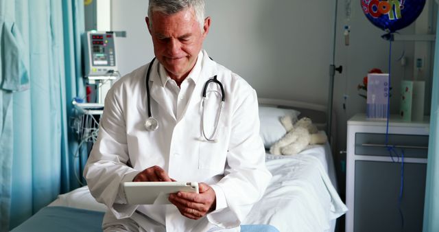 Senior Doctor Using Digital Tablet in Hospital Room - Download Free Stock Images Pikwizard.com