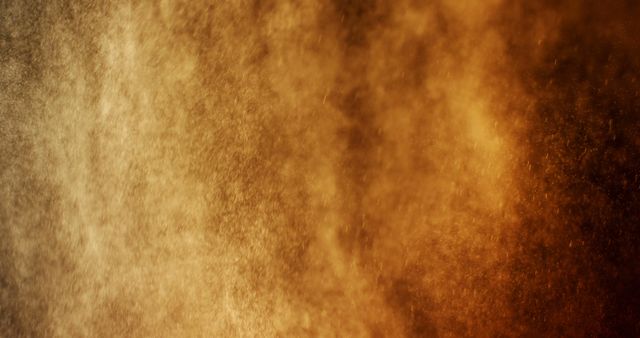 A close-up view of a warm, textured spray or mist, steam. The image captures the intricate details and movement within the mist, evoking a sense of warmth.