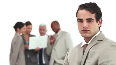 Pensive Businessman in Team Meeting with Focus on Individual
