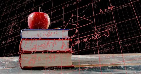 Educational Learning Concept Stack of Books with Apple and Math Formulas