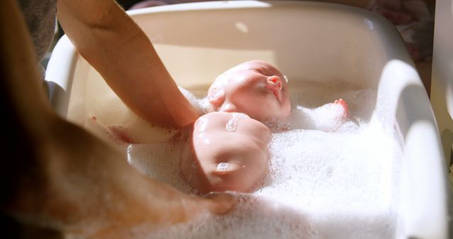 Newborn Taking Bath in Tub with Foamy Water - Download Free Stock Images Pikwizard.com