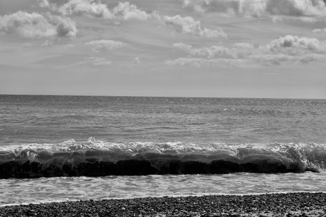 Dramatic Black and White Ocean Waves Crashing on Pebble Beach - Download Free Stock Photos Pikwizard.com