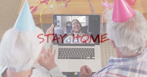 Senior Couple Celebrating Virtual Birthday with Family on Laptop