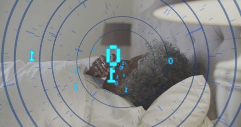 Elderly Woman Relaxing with Technology in Comforting Bedroom