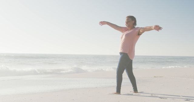 Happy Woman Enjoying Freedom at the Beach on a Sunny Day - Download Free Stock Images Pikwizard.com