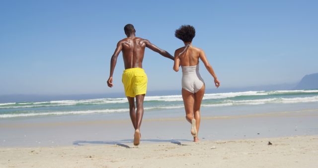 Happy Couple Running on Sunny Beach - Download Free Stock Images Pikwizard.com