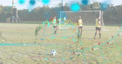 Soccer players training with digital performance overlay on outdoor grass pitch