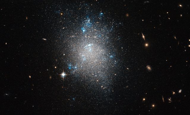 Hubble Image of Dwarf Galaxy NGC 5477 in Messier 101 Group - Download Free Stock Photos Pikwizard.com