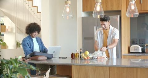 Young Men Collaborating in Modern Kitchen Office Environment
