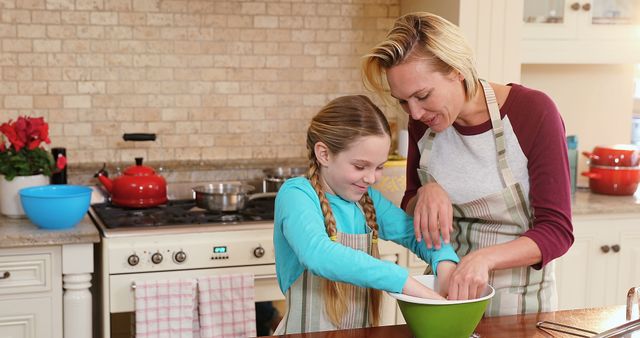 Woman and Girl Baking Together in Kitchen - Download Free Stock Images Pikwizard.com