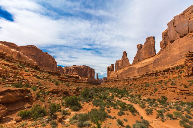 Majestic Sandstone Formations in Arches National Park Under Cloudy Sky - Download Free Stock Photos Pikwizard.com