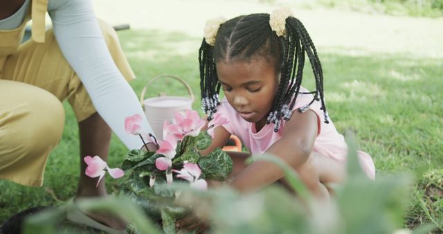 Young Girl Gardening with Mother in Sunny Yard - Download Free Stock Images Pikwizard.com