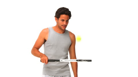 Athletic Man Practicing Tennis with Racket
