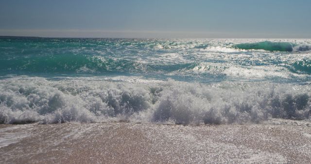 Waves Crashing on Sandy Beach under Bright Blue Sky - Download Free Stock Images Pikwizard.com