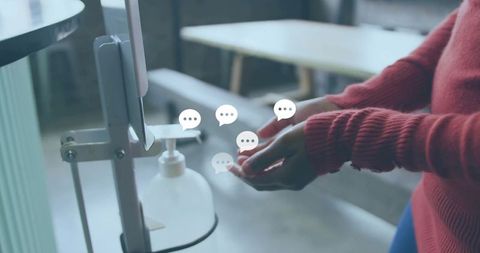 Woman wearing red sweater dispensing hand sanitizer with chat bubble icons for hygiene