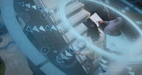 Overhead professionals reviewing documents on escalator with futuristic hud overlay in lobby