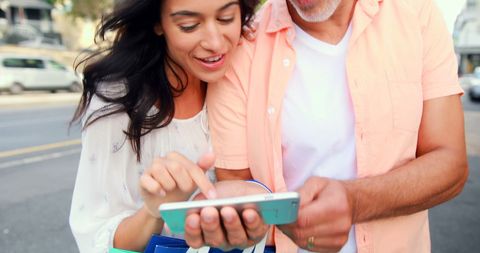 Cheerful Couple Sharing Smartphone Adventure - Download Free Stock Images Pikwizard.com