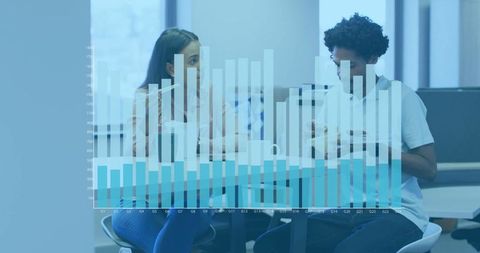 Young Professionals Analyzing Bar Chart in Modern Office Lounge