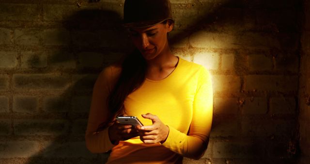 Young Woman Texting on Smartphone in Dimly Lit Room - Download Free Stock Photos Pikwizard.com