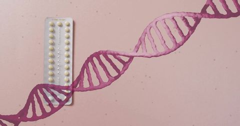 Dna strand with birth control pills on pink background