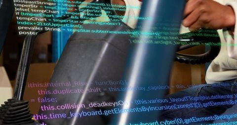 Man Reviewing Data While Operating Machinery in Warehouse