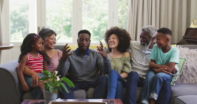 Multigenerational African American family relaxing and laughing on sofa - Download Free Stock Images Pikwizard.com