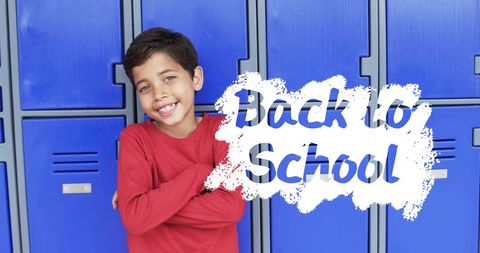 Smiling young boy ready for school against locker background