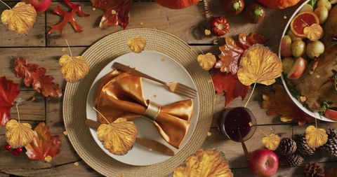 Thanksgiving Table Surrounded by Falling Autumn Leaves - Download Free Stock Images Pikwizard.com