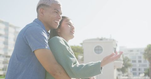 Romantic Couple Embracing Outdoors on a Sunny Day