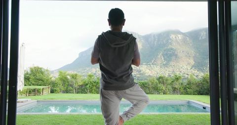 Man Practicing Yoga in Serene Mountain View Setting
