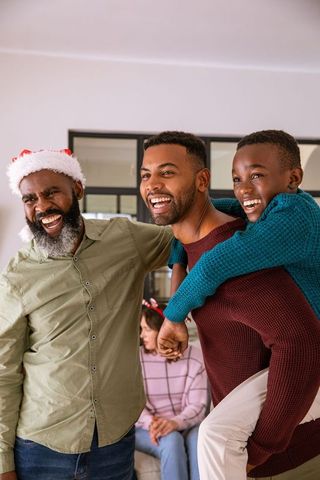 Joyful African American Family Celebrating in Living Room