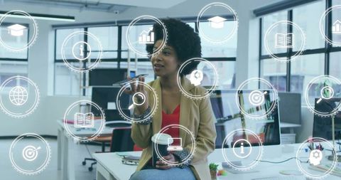 Business Woman in Modern Office with Holographic Analytics Icons